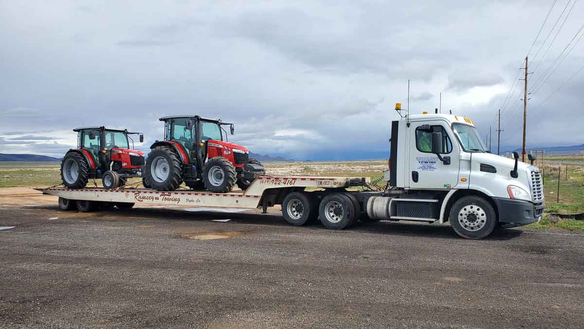 Ramsey Towing semi hauling mudder tractors