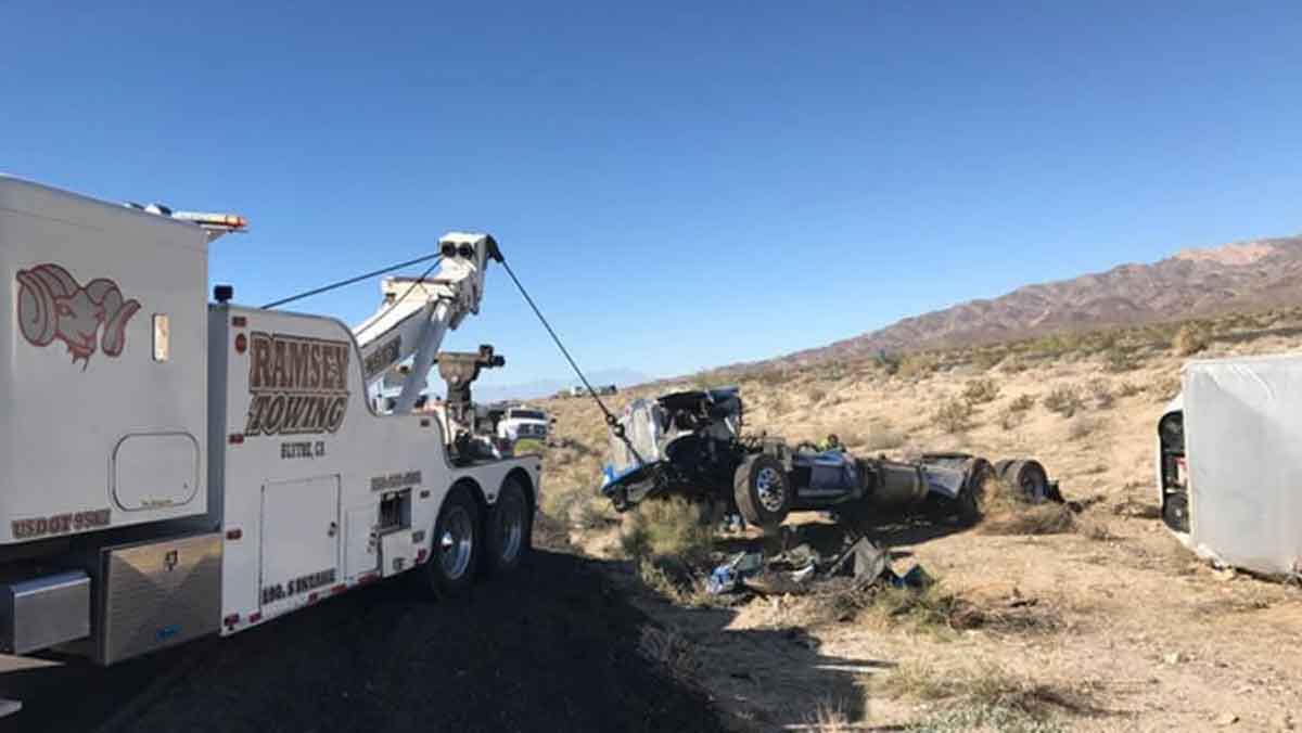 Ramsey Towing mobile crane recovering semi truck rollover